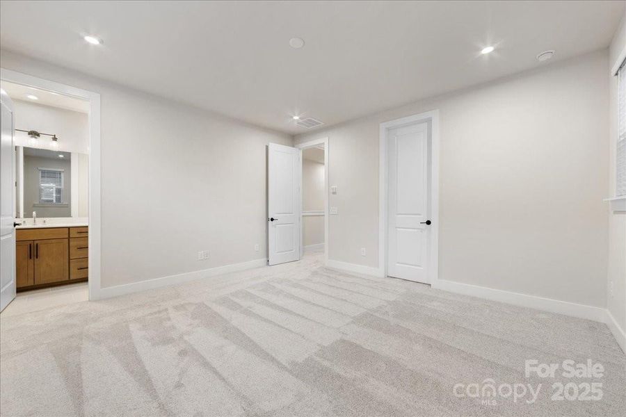 9' Ceilings and 8' Doorways at Primary Bedroom.