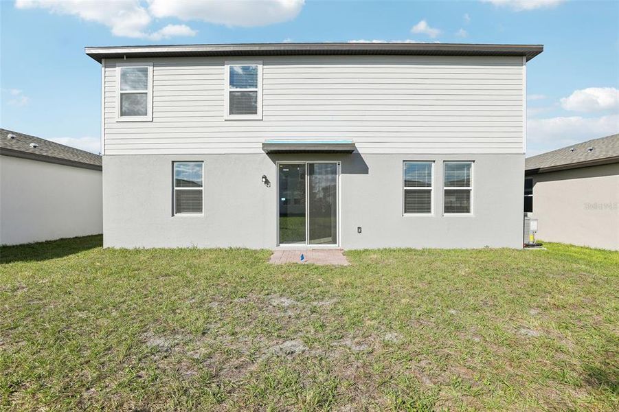 Exterior details and patio area of a home in Lawson Dunes - Signature Series, Haines City (Image 27).