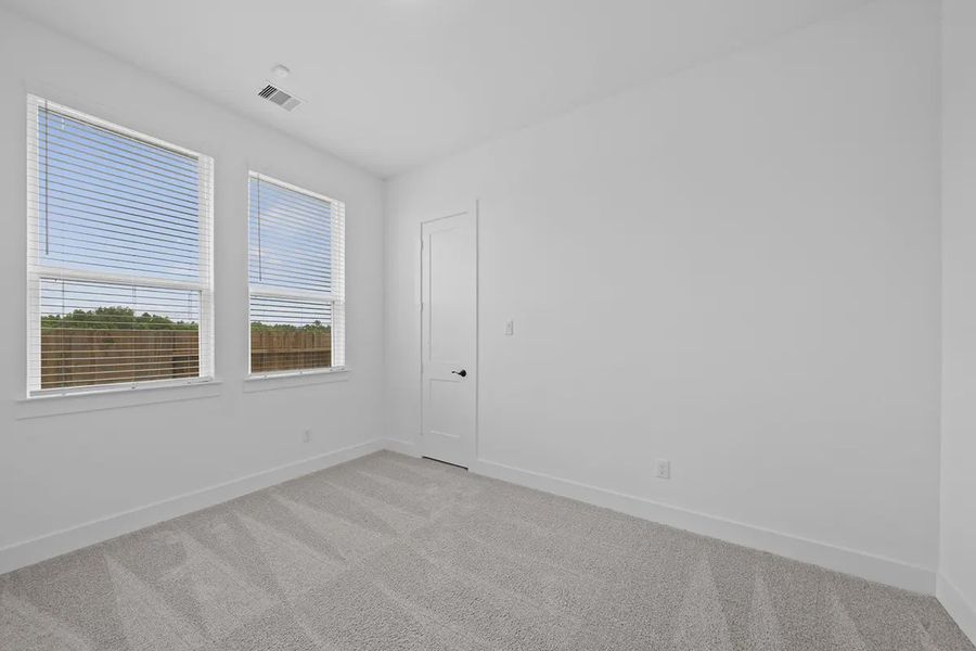 Representative unfurnished interior of a home built from the Summerton by Chesmar Homes in University Heights, Round Rock (Image 18).