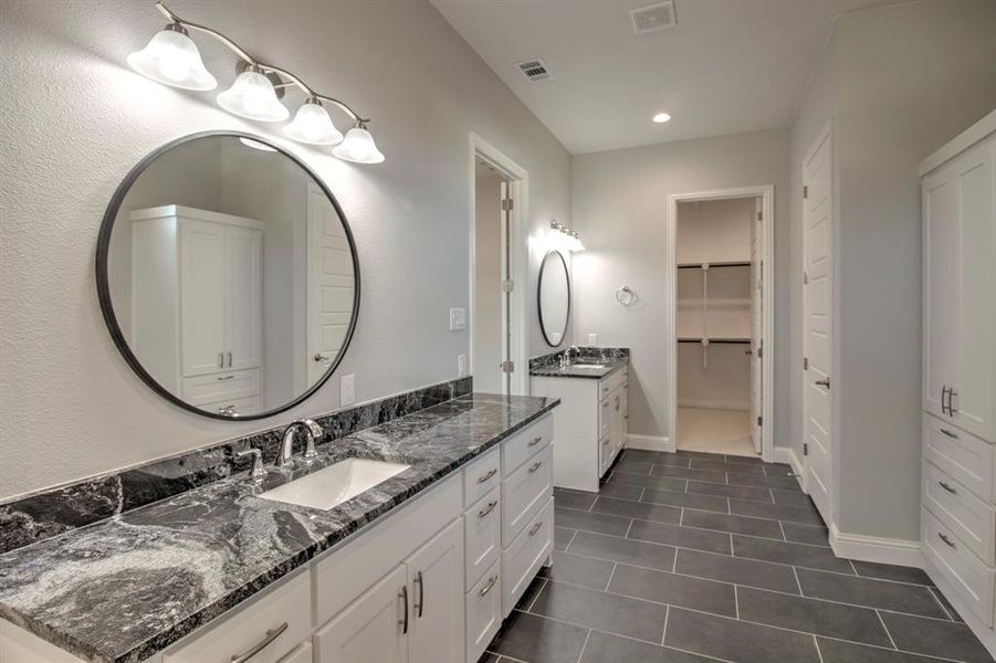 Bathroom with vanity and tile patterned floors