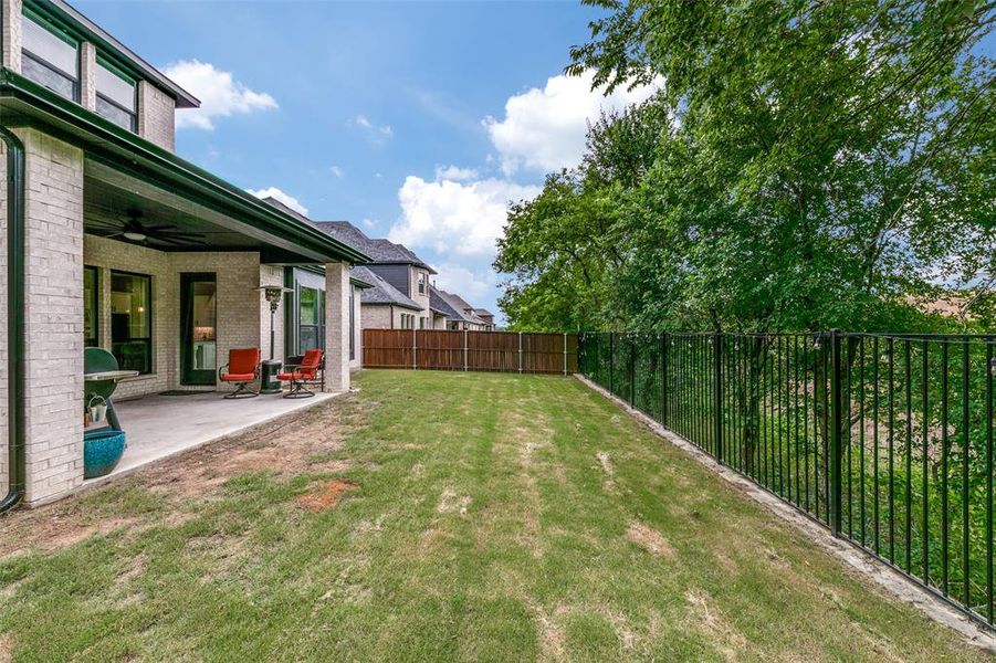 View of yard featuring a patio and ceiling fan