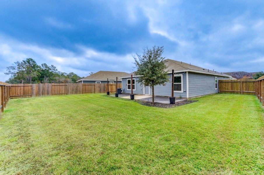 Exterior details and patio area of a home in Williams Trace, Magnolia (Image 27).