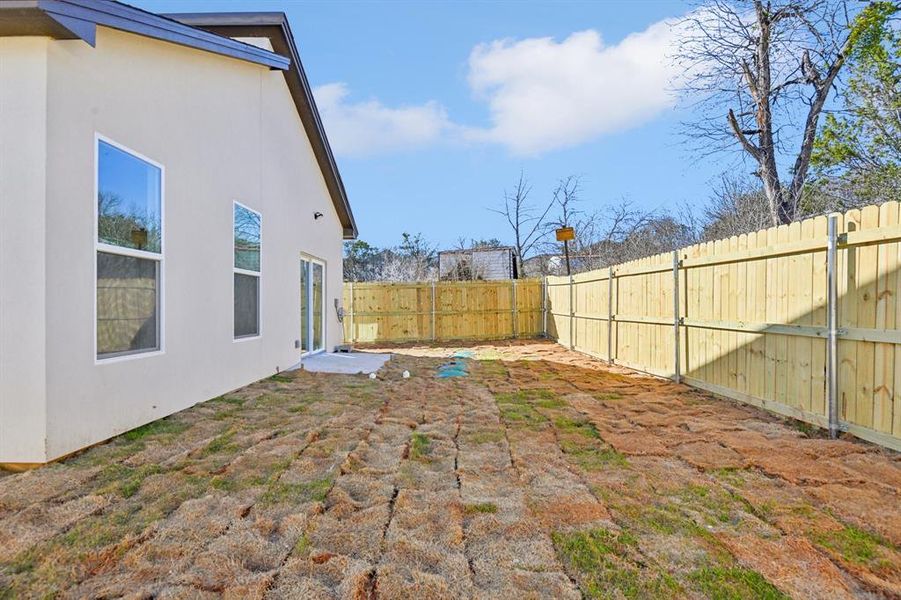 View of yard with a fenced backyard