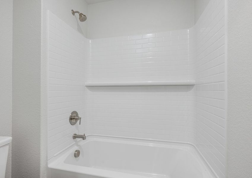 The secondary bathroom has a shower-tub combo.