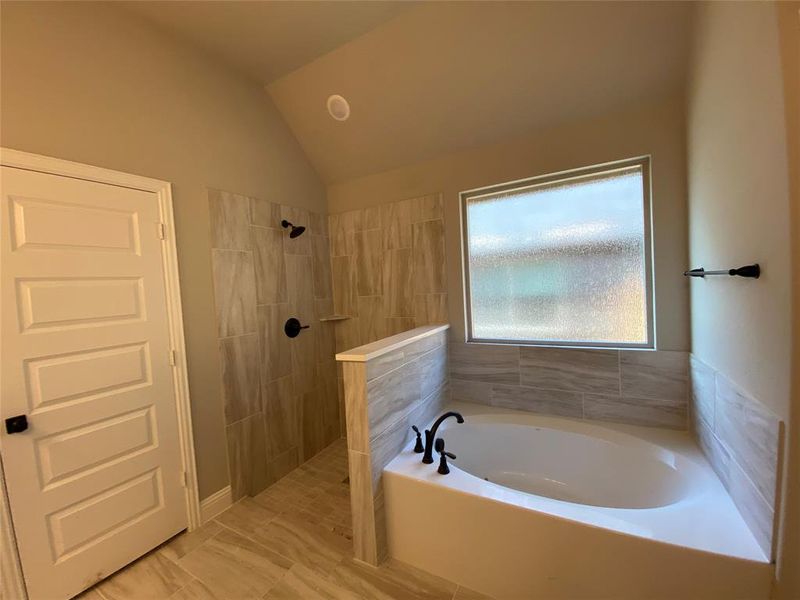 Master bath has separate garden tub & walk-in shower with tile pan will have frameless glass surround (not installed yet) Master bath has separate garden tub & walk-in shower with tile pan will have frameless glass surround (not installed yet)