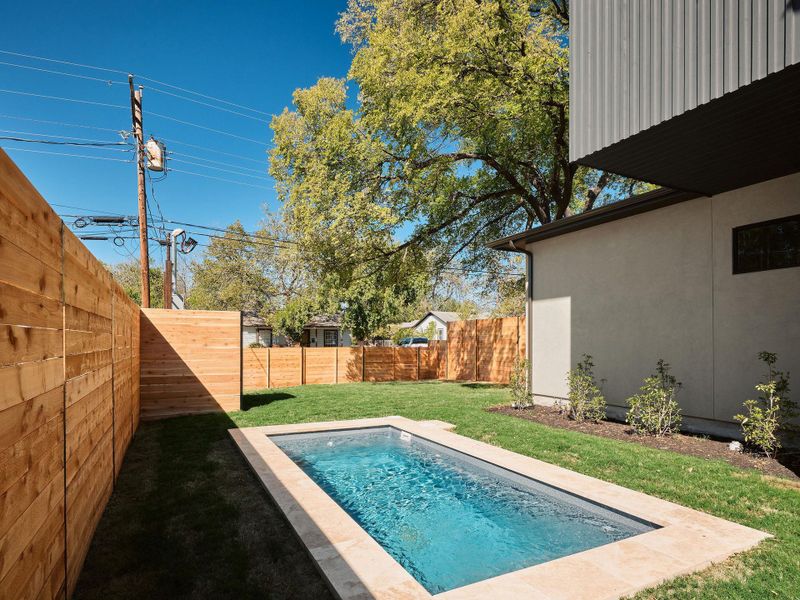 View of pool with a fenced backyard and a patio area