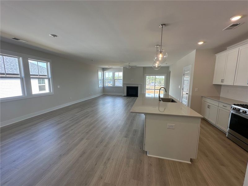 Bright and airy open-concept space featuring a mod