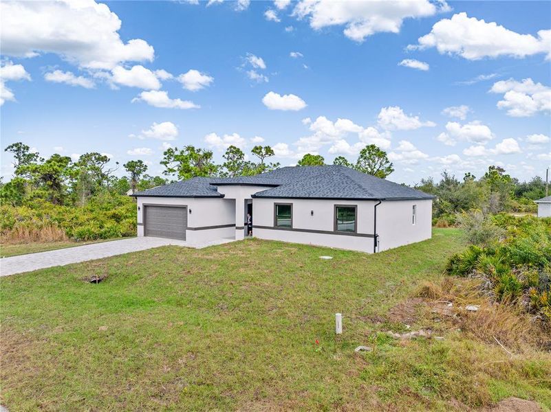Front exterior of a new home in , Port Charlotte, FL, highlighting curb appeal (Image 26).