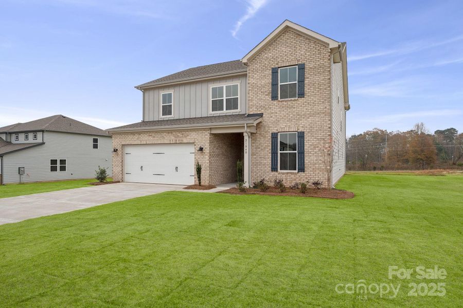 Front exterior of a new home in Running Creek, Locust, NC, highlighting curb appeal (Image 2). Front exterior of a new home in Running Creek, Locust, NC, highlighting curb appeal (Image 2).