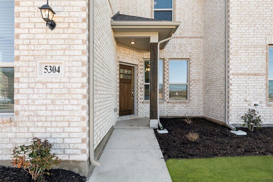 Representative exterior photo of a completed home built from the Conroe by Impression Homes in Creekshaw, Royse City, TX (Image 5). Representative exterior photo of a completed home built from the Conroe by Impression Homes in Creekshaw, Royse City, TX (Image 5).