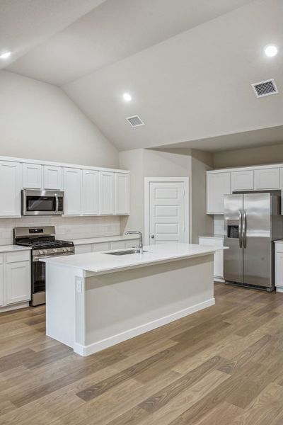 Kitchen in the Wimbledon home plan by Trophy Signature Homes – REPRESENTATIVE PHOTO