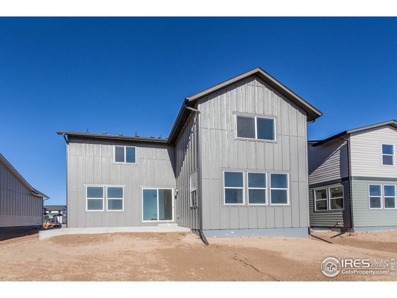 Front exterior of a new home in Trailside Story Collection - Single Family Homes, Timnath, CO, highlighting curb appeal (Image 20).