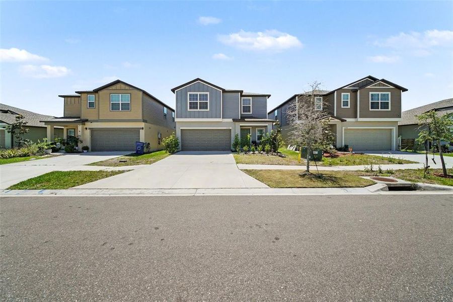 Front exterior of a new home in Two Rivers, Zephyrhills, FL, highlighting curb appeal (Image 23).
