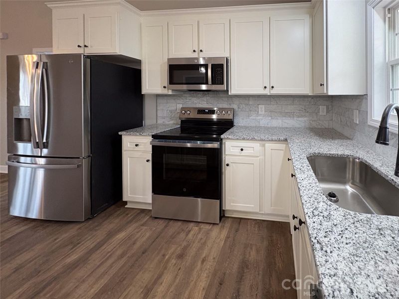 Furnished interior view inside a new home in , Statesville (Image 6).