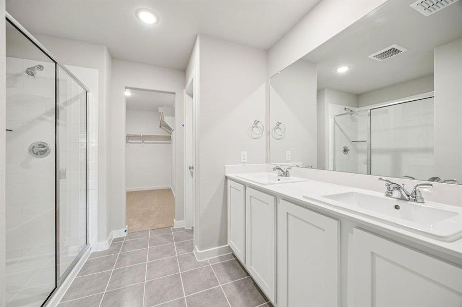 Primary Bathroom in the Hayden home plan by Trophy Signature Homes – REPRESENTATIVE PHOTO