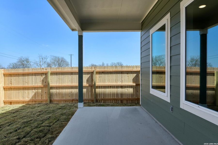 Exterior details and patio area of a home in Hennersby Hollow, San Antonio (Image 3).