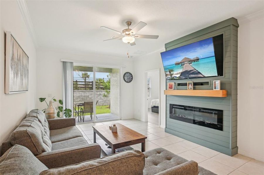 Living area with view of patio. Living area with view of patio.
