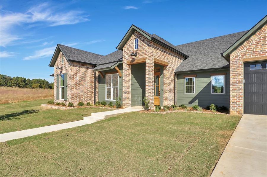 Front exterior of a new home in , Flint, TX, highlighting curb appeal (Image 22).