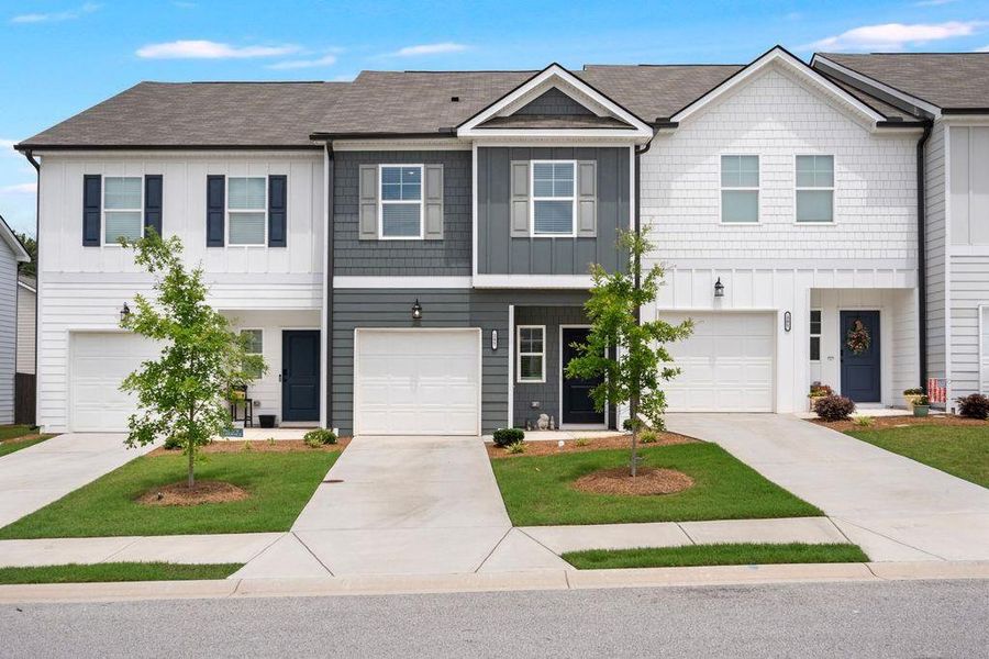 Front exterior of a new home in , Hoschton, GA, highlighting curb appeal (Image 26).