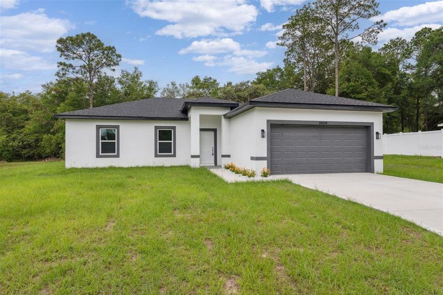 Front exterior of a new home in , Citrus Springs, FL, highlighting curb appeal (Image 29).