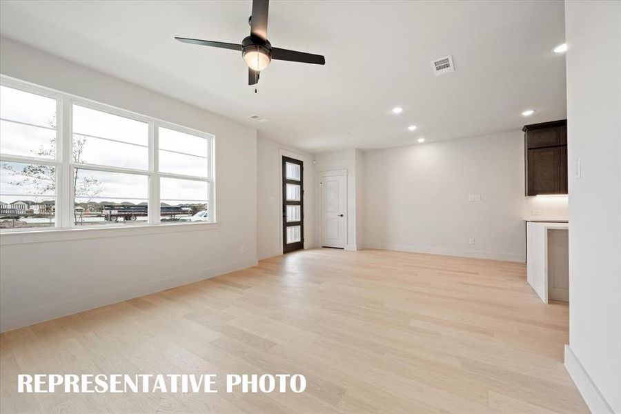 Plenty of memories to be made in this light filled family room!  REPRESENTATIVE PHOTO