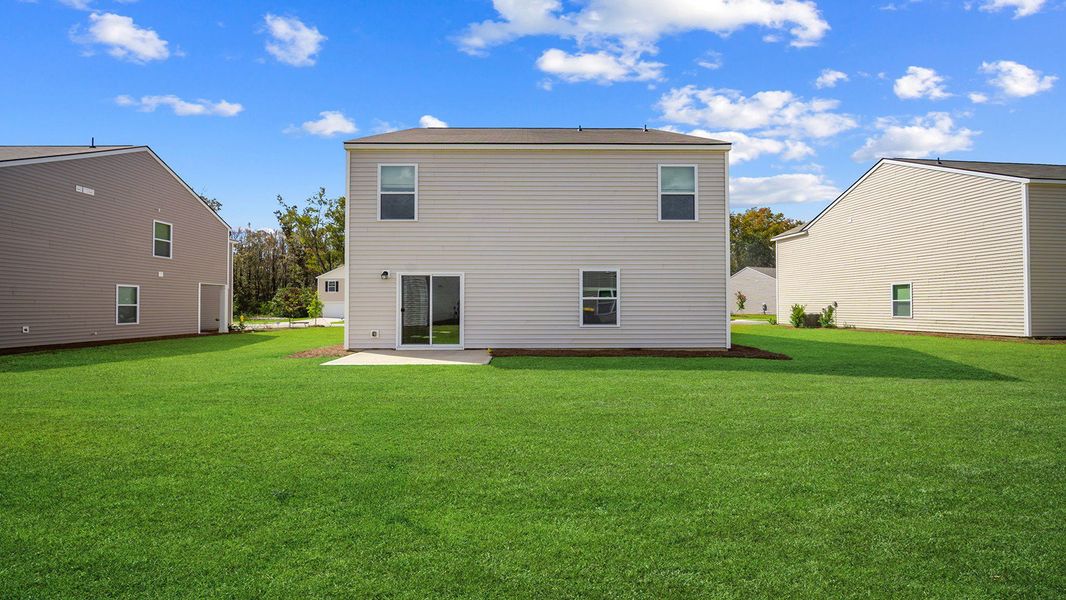 Exterior details and patio area of a home in Cobblestone Village, Savannah (Image 4).
