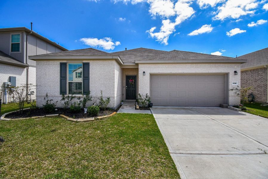 Front exterior of a new home in , Alvin, TX, highlighting curb appeal (Image 18).