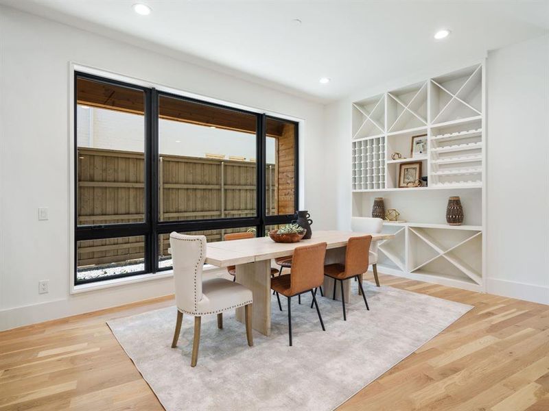 Dining room featuring light wood finished floors and recessed lighting