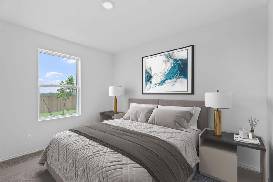 Carpeted bedroom with baseboards Carpeted bedroom with baseboards