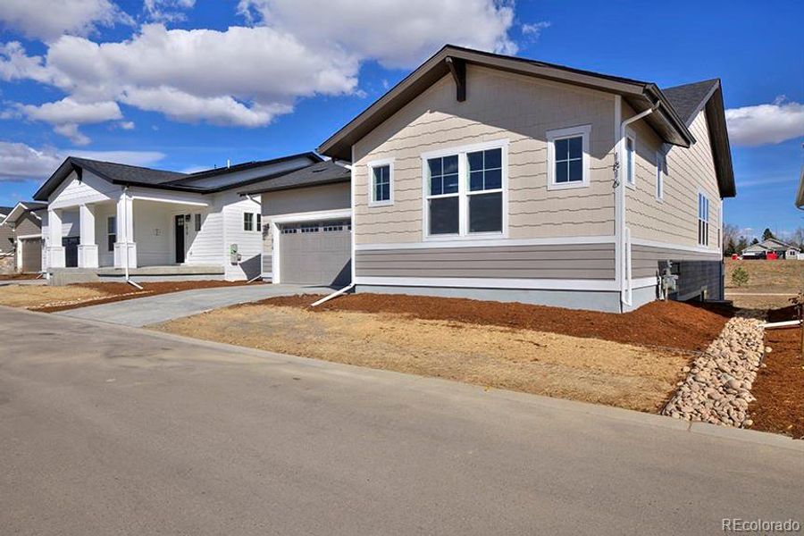 Front exterior of a new home in , Fort Collins, CO, highlighting curb appeal (Image 23).