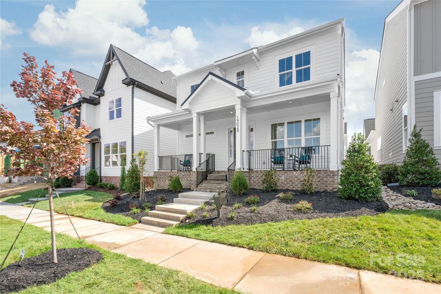 Front exterior of a new home in , Davidson, NC, highlighting curb appeal (Image 24).