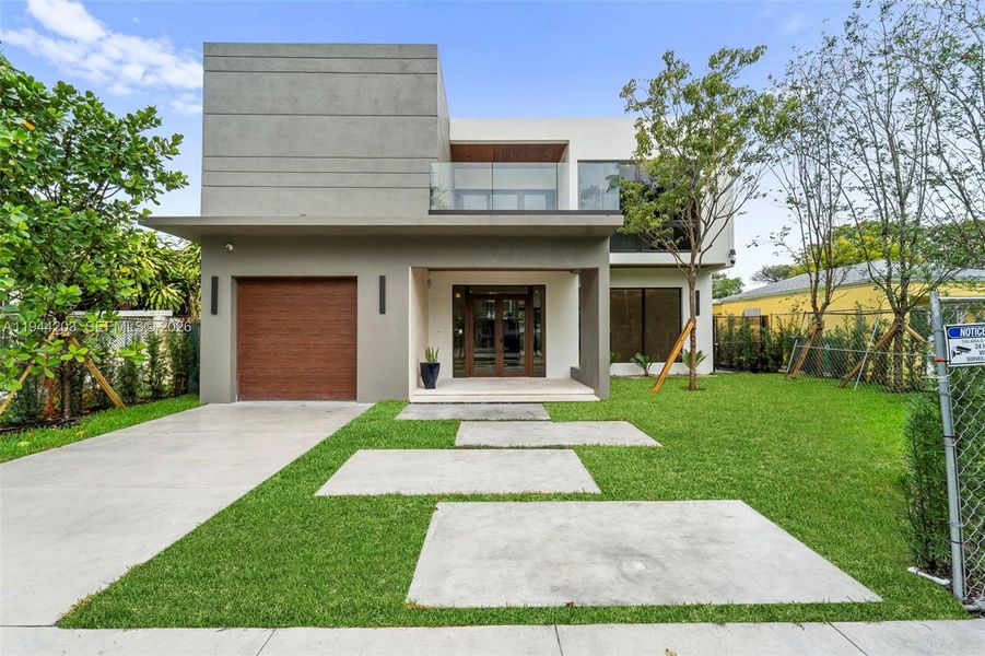 Front exterior of a new home in , Miami, FL, highlighting curb appeal (Image 1). Front exterior of a new home in , Miami, FL, highlighting curb appeal (Image 1).