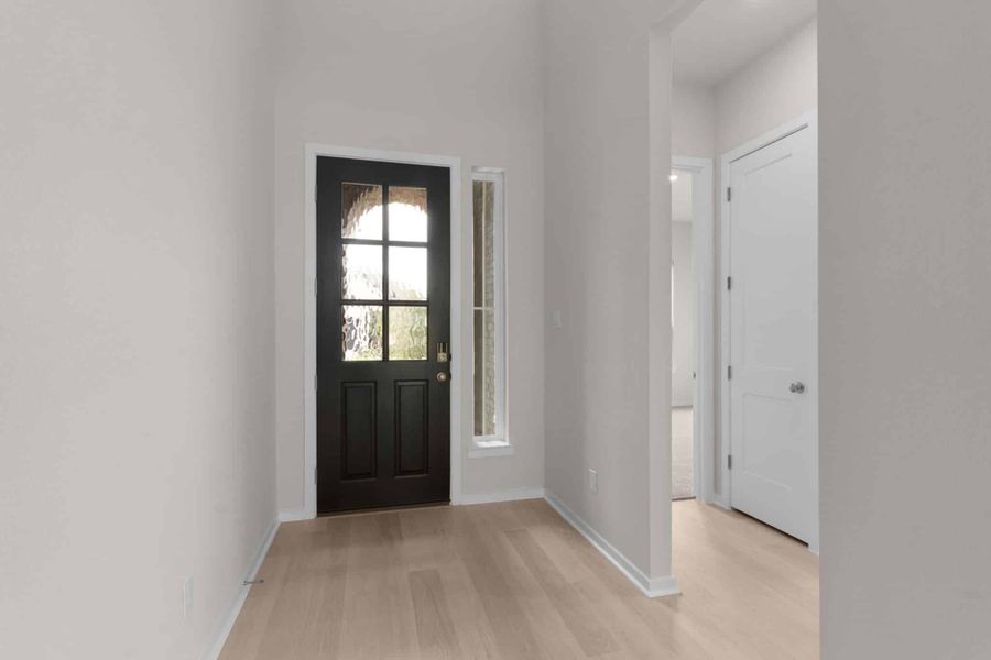 Representative unfurnished interior of a home built from the Madison by Chesmar Homes in University Heights, Round Rock (Image 11).