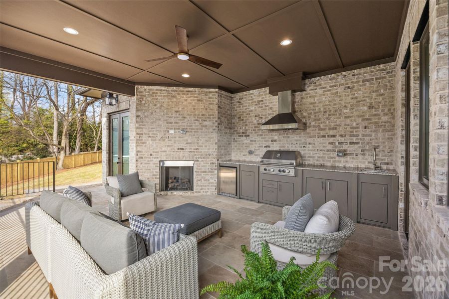 Covered patio with kitchenette and fireplace