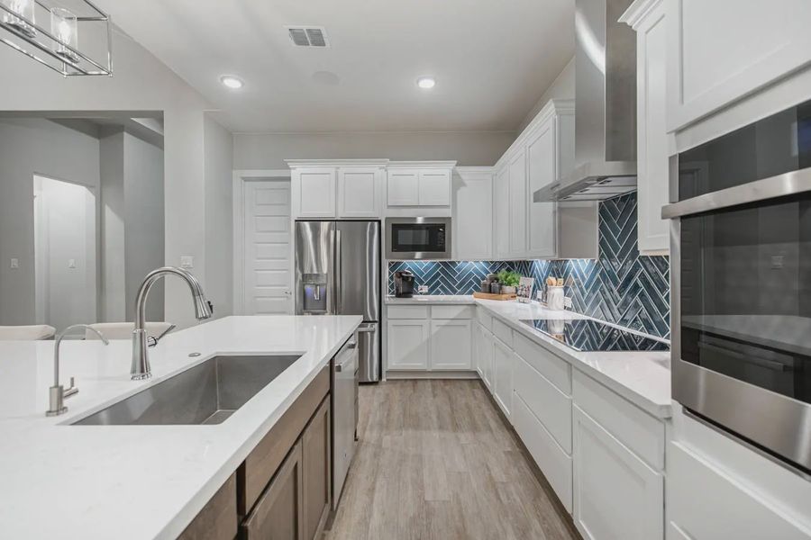 Representative furnished interior of a home built from the Gregory by Chesmar Homes in Heimer Estates at Garden Ridge, San Antonio (Image 7).
