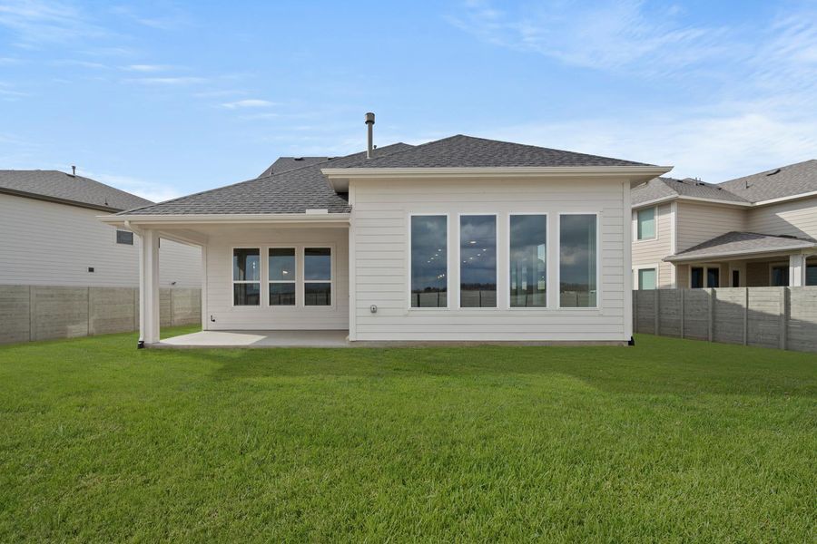 Exterior details and patio area of a home in The Retreat at Harvest, Argyle (Image 18).