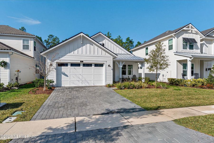 Front exterior of a new home in , Ponte Vedra, FL, highlighting curb appeal (Image 24).