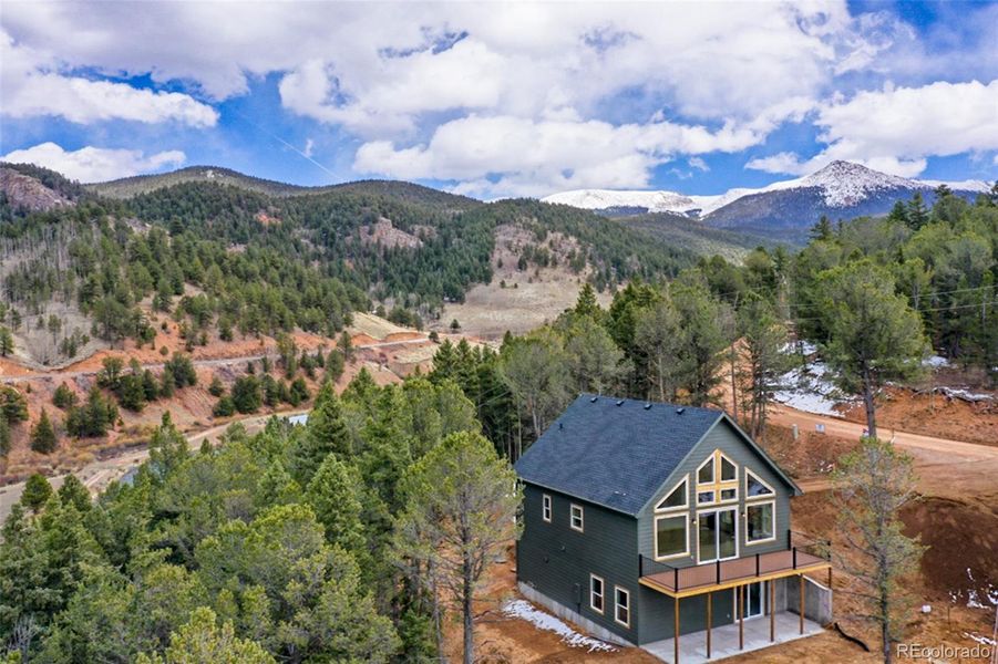 Front exterior of a new home in , Divide, CO, highlighting curb appeal (Image 24). Front exterior of a new home in , Divide, CO, highlighting curb appeal (Image 24).