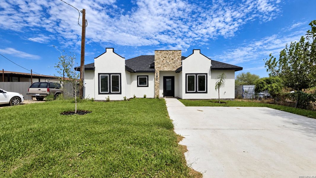 Front exterior of a new home in , Eagle Pass, TX, highlighting curb appeal (Image 1). Front exterior of a new home in , Eagle Pass, TX, highlighting curb appeal (Image 1).