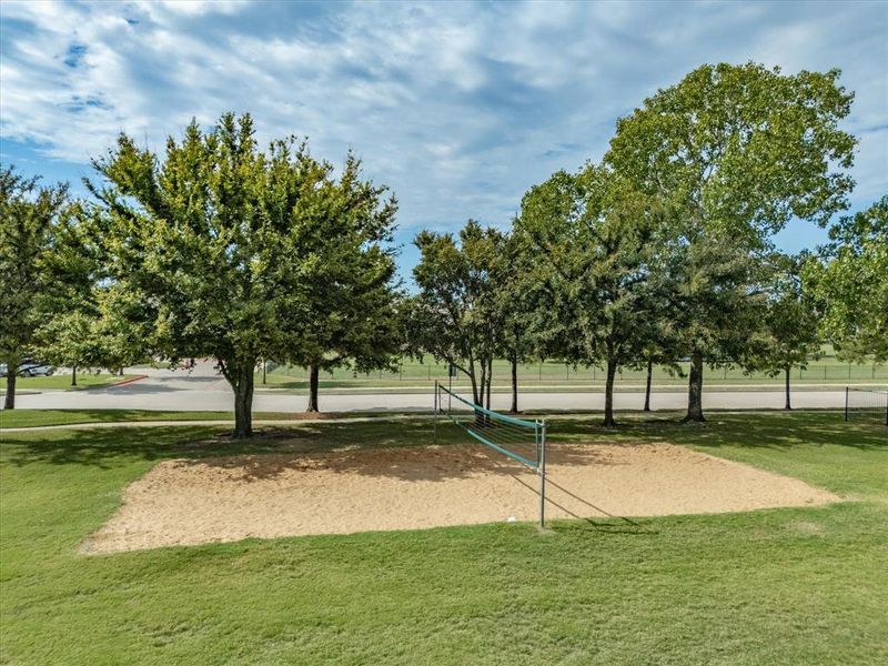 View of property's community featuring volleyball court and a lawn View of property's community featuring volleyball court and a lawn