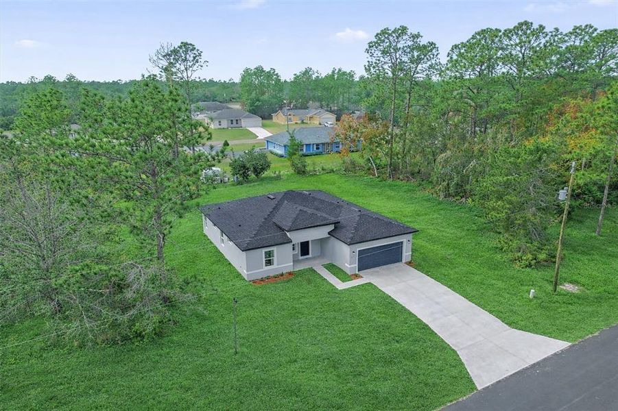 Front exterior of a new home in , Ocala, FL, highlighting curb appeal (Image 21).
