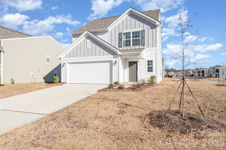 Front exterior of a new home in Sullivan Farm, Statesville, NC, highlighting curb appeal (Image 22). Front exterior of a new home in Sullivan Farm, Statesville, NC, highlighting curb appeal (Image 22).