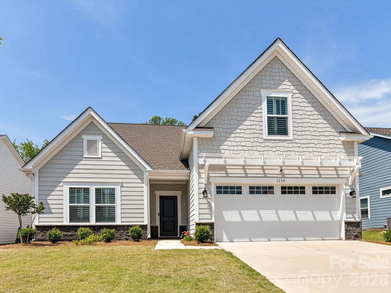 Front exterior of a new home in , Monroe, NC, highlighting curb appeal (Image 25).