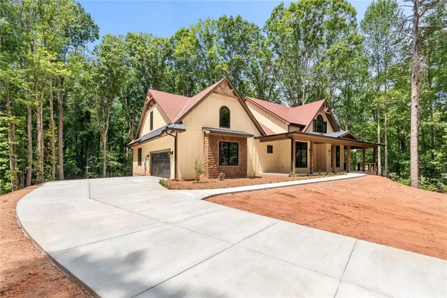 Front exterior of a new home in , Dawsonville, GA, highlighting curb appeal (Image 24). Front exterior of a new home in , Dawsonville, GA, highlighting curb appeal (Image 24).