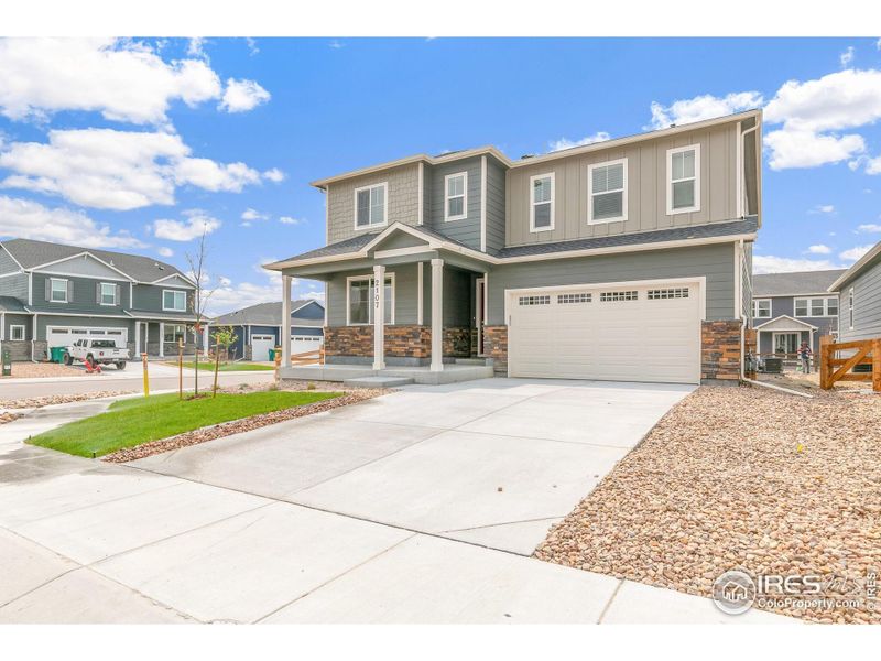 Front exterior of a new home in Vista Meadows, Fort Lupton, CO, highlighting curb appeal (Image 2). Front exterior of a new home in Vista Meadows, Fort Lupton, CO, highlighting curb appeal (Image 2).