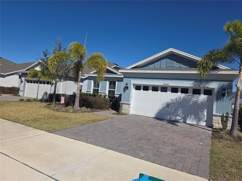 Front exterior of a new home in , Montverde, FL, highlighting curb appeal (Image 1). Front exterior of a new home in , Montverde, FL, highlighting curb appeal (Image 1).