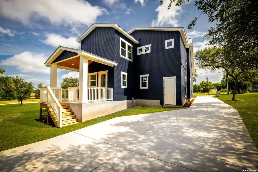 Front exterior of a new home in , Blanco, TX, highlighting curb appeal (Image 2). Front exterior of a new home in , Blanco, TX, highlighting curb appeal (Image 2).