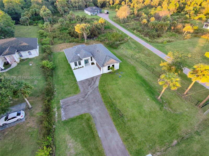 Front exterior of a new home in , Naples, FL, highlighting curb appeal (Image 28). Front exterior of a new home in , Naples, FL, highlighting curb appeal (Image 28).