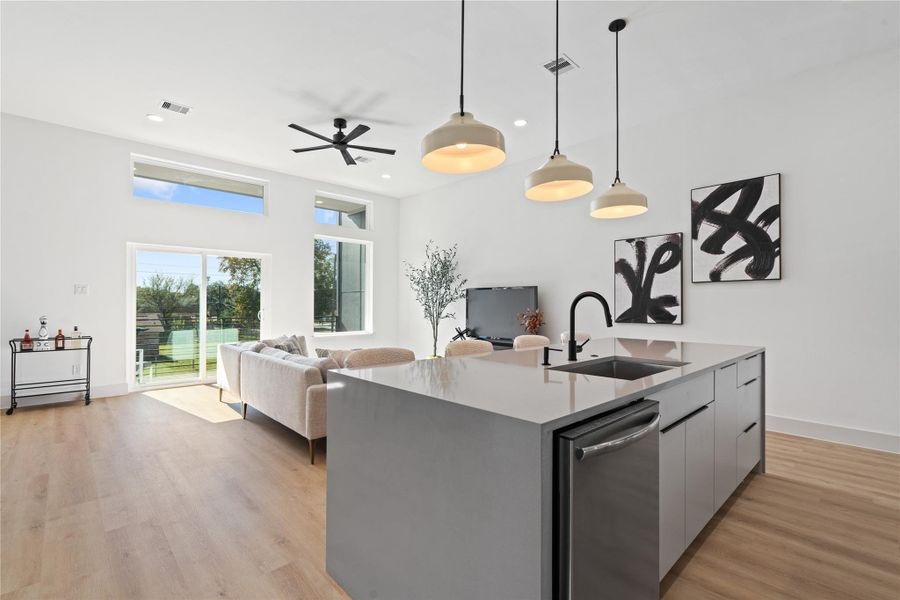 A rare 11-ft ceiling height shapes the main living area, enhancing scale, light, & the connection to the covered balcony beyond. A rare 11-ft ceiling height shapes the main living area, enhancing scale, light, & the connection to the covered balcony beyond.