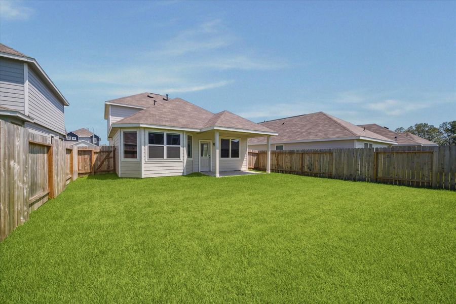 Front exterior of a new home in Townsend Reserve, Splendora, TX, highlighting curb appeal (Image 17).
